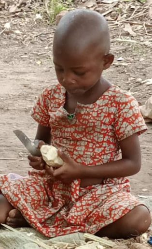 child carving wood